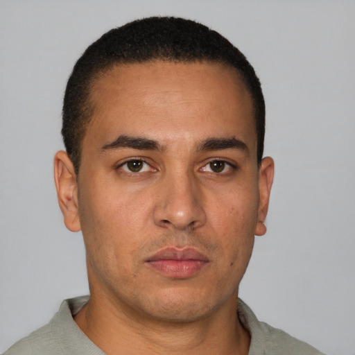 Neutral latino young-adult male with short  brown hair and brown eyes