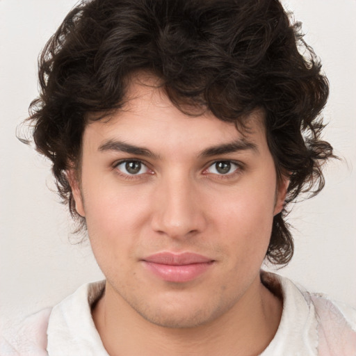 Joyful white young-adult male with medium  brown hair and brown eyes