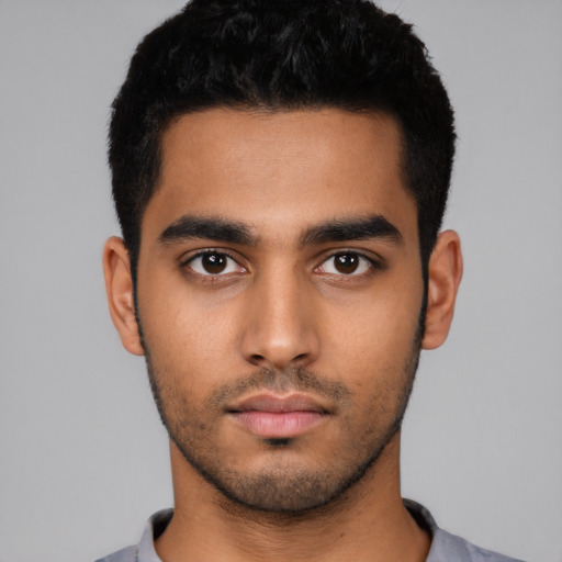 Neutral latino young-adult male with short  black hair and brown eyes