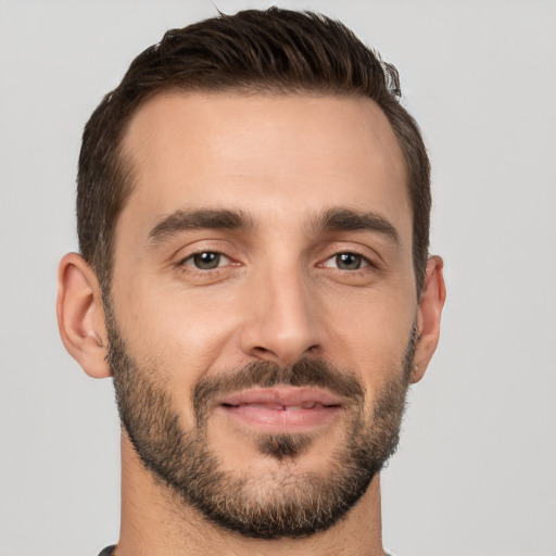 Joyful white young-adult male with short  brown hair and brown eyes