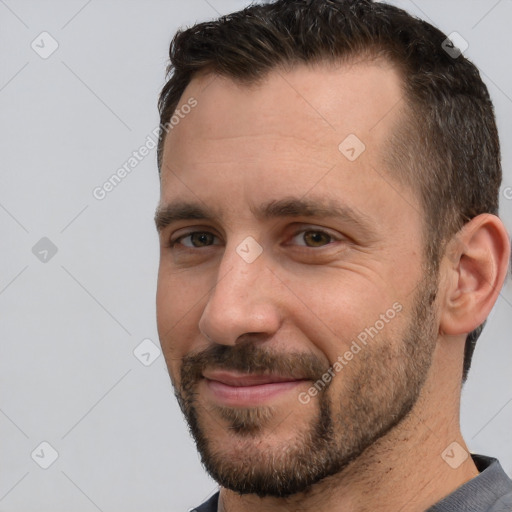 Joyful white adult male with short  brown hair and brown eyes