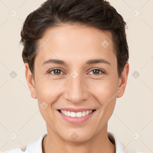 Joyful white young-adult female with short  brown hair and brown eyes