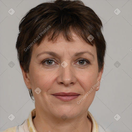 Joyful white adult female with short  brown hair and grey eyes