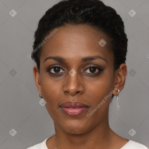 Joyful black young-adult female with short  black hair and brown eyes