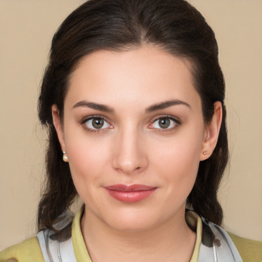 Joyful white young-adult female with medium  brown hair and brown eyes