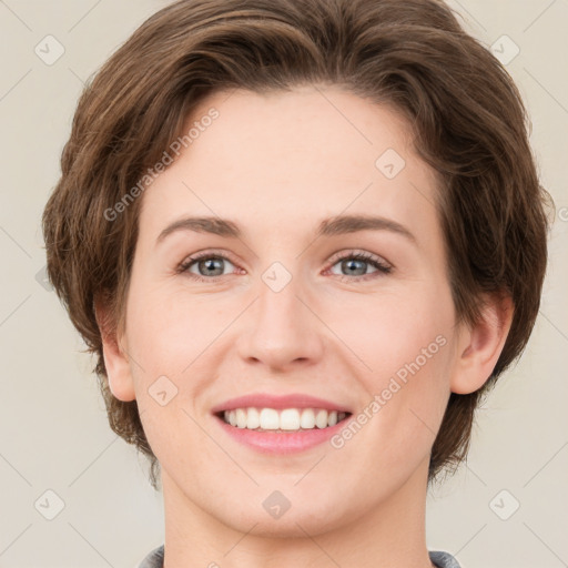 Joyful white young-adult female with medium  brown hair and green eyes