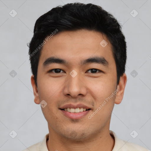 Joyful asian young-adult male with short  black hair and brown eyes