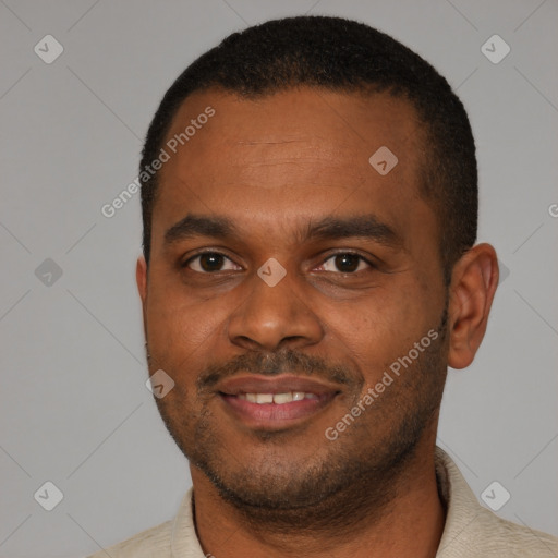 Joyful latino young-adult male with short  black hair and brown eyes