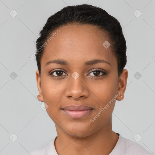 Joyful black young-adult female with short  black hair and brown eyes