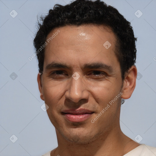 Joyful white adult male with short  black hair and brown eyes