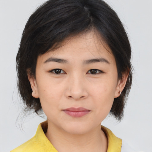 Neutral asian young-adult female with medium  brown hair and brown eyes