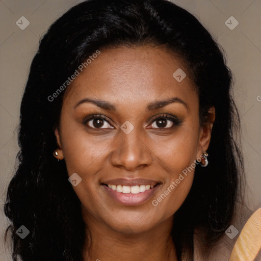 Joyful black young-adult female with long  brown hair and brown eyes