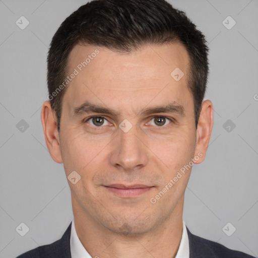 Joyful white adult male with short  brown hair and brown eyes