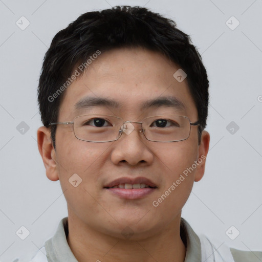 Joyful asian young-adult male with short  brown hair and brown eyes