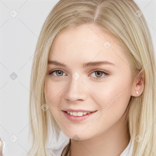 Joyful white young-adult female with long  brown hair and blue eyes