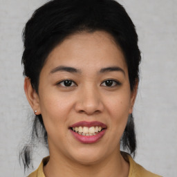 Joyful asian young-adult female with medium  black hair and brown eyes