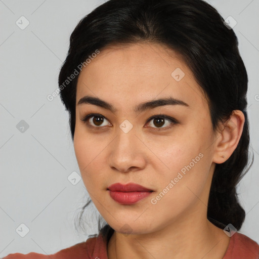 Joyful asian young-adult female with medium  black hair and brown eyes