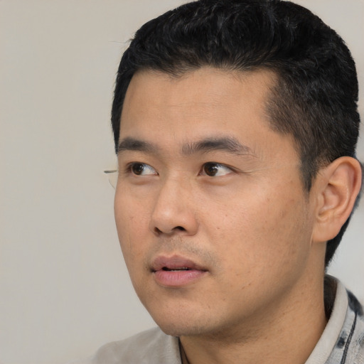 Neutral asian young-adult male with short  black hair and brown eyes