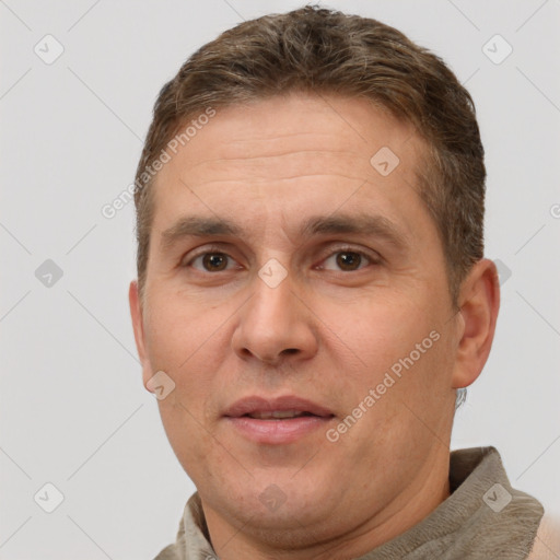 Joyful white adult male with short  brown hair and brown eyes