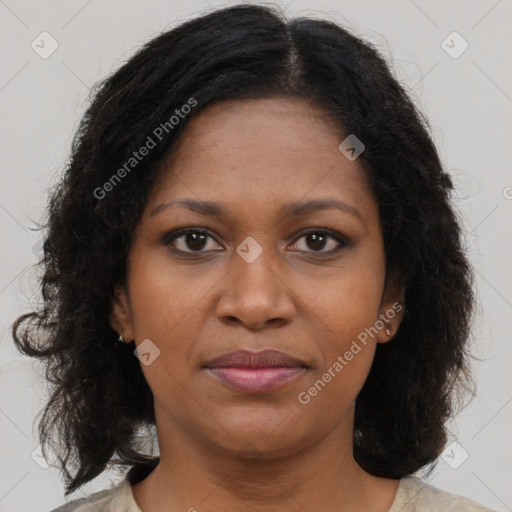 Joyful black young-adult female with medium  brown hair and brown eyes