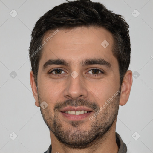 Joyful white young-adult male with short  black hair and brown eyes