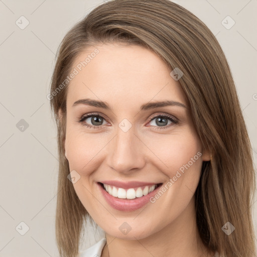 Joyful white young-adult female with long  brown hair and grey eyes