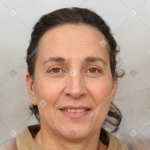 Joyful white adult female with short  brown hair and brown eyes