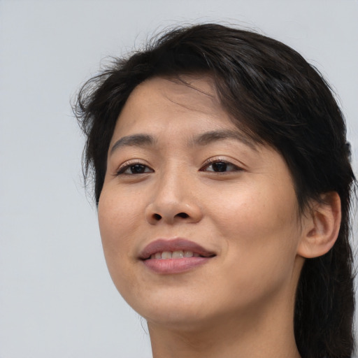 Joyful asian young-adult female with medium  brown hair and brown eyes