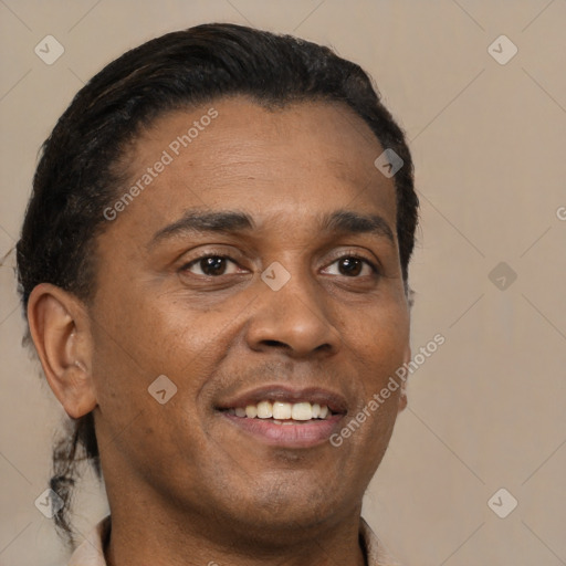 Joyful black adult male with short  black hair and brown eyes