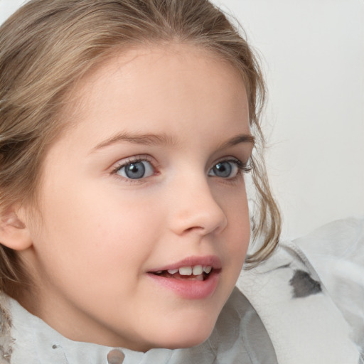 Joyful white child female with medium  brown hair and blue eyes