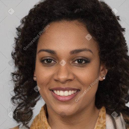 Joyful black young-adult female with medium  brown hair and brown eyes