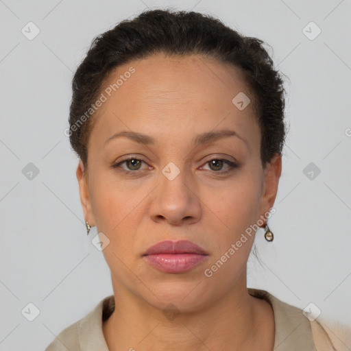 Joyful latino adult female with short  brown hair and brown eyes