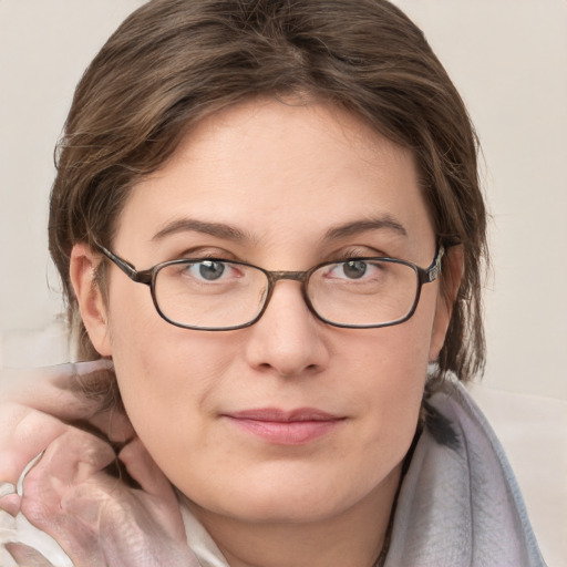 Joyful white young-adult female with medium  brown hair and blue eyes