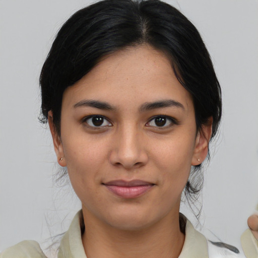Joyful asian young-adult female with medium  brown hair and brown eyes