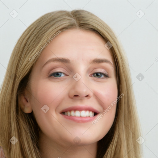 Joyful white young-adult female with long  brown hair and blue eyes