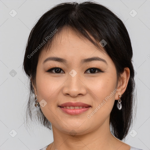 Joyful asian young-adult female with medium  brown hair and brown eyes