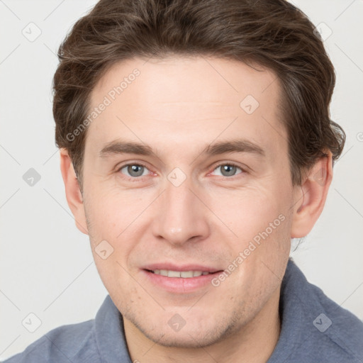 Joyful white adult male with short  brown hair and grey eyes