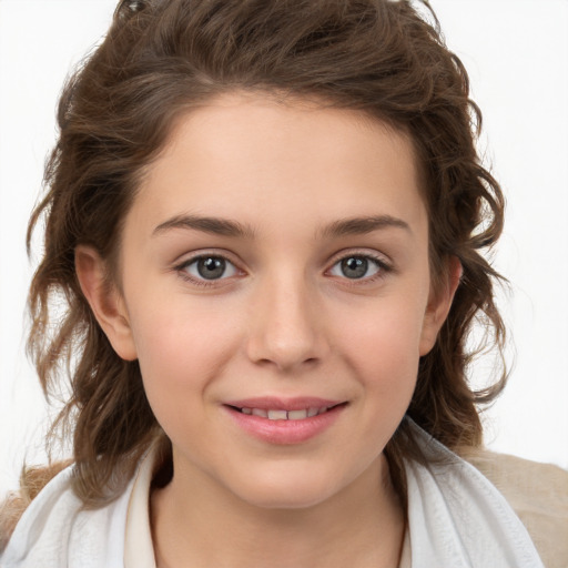 Joyful white child female with medium  brown hair and brown eyes