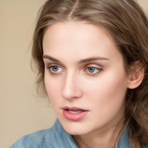 Neutral white young-adult female with long  brown hair and blue eyes