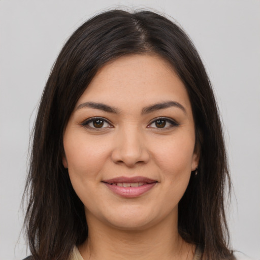 Joyful latino young-adult female with medium  brown hair and brown eyes