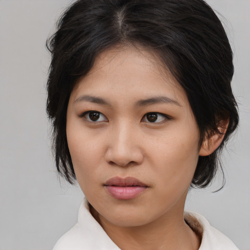 Neutral asian young-adult female with medium  brown hair and brown eyes