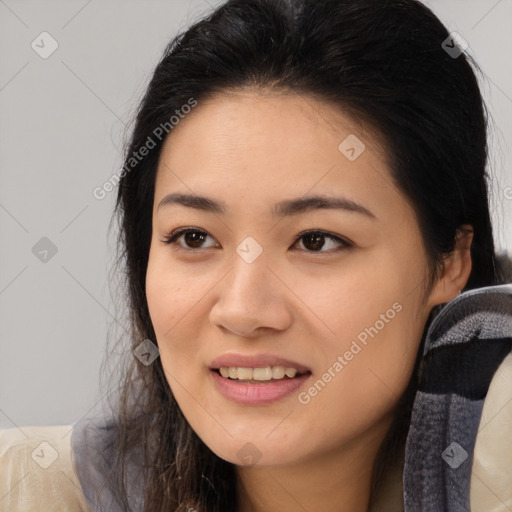 Joyful latino young-adult female with long  brown hair and brown eyes