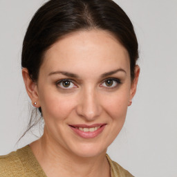 Joyful white young-adult female with medium  brown hair and brown eyes