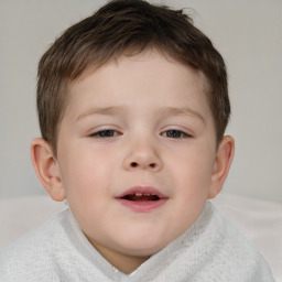 Joyful white child male with short  brown hair and brown eyes