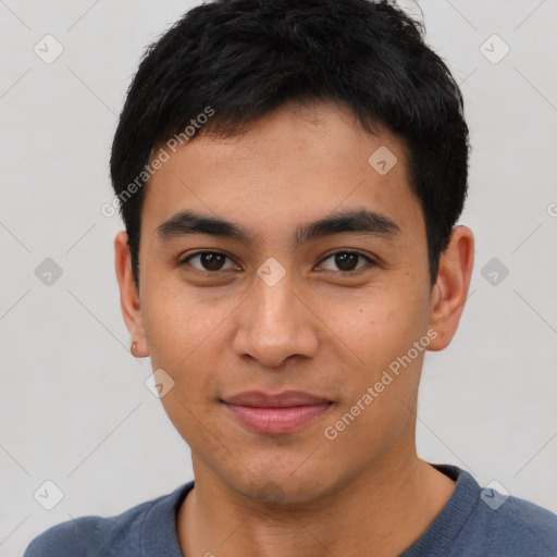 Joyful asian young-adult male with short  black hair and brown eyes