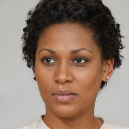 Neutral black young-adult female with short  brown hair and brown eyes