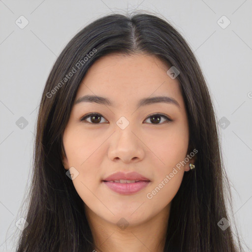 Joyful asian young-adult female with long  brown hair and brown eyes