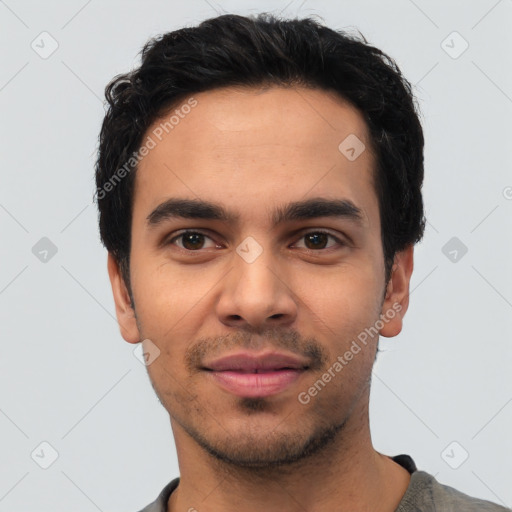 Joyful latino young-adult male with short  black hair and brown eyes