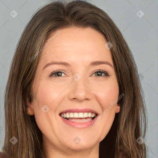 Joyful white adult female with long  brown hair and brown eyes