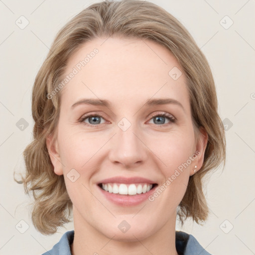 Joyful white young-adult female with medium  brown hair and blue eyes